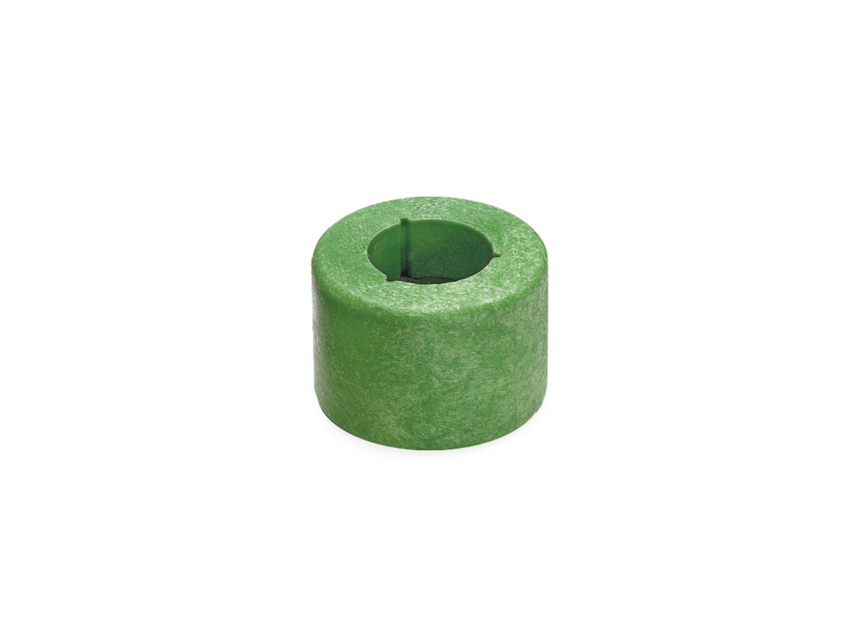 A green cylindrical foam magnetic float from the B12469 Series, featuring a hollow center and a slit running from the edge to the hole in the middle, is placed on a white background. by Standex Detect