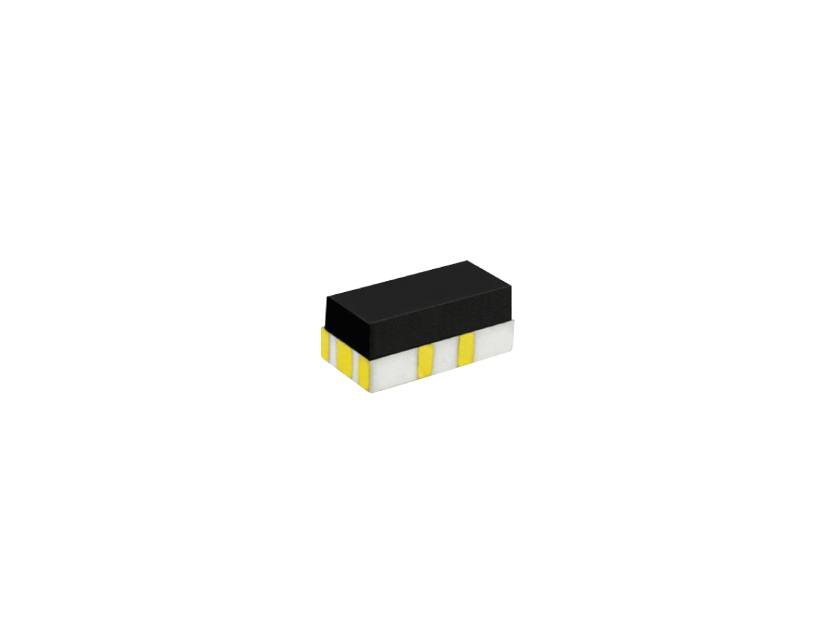 A small rectangular electronic component from the CRR Series with a black top, white base, and yellow metallic contacts on the sides, often used as a reed relay, isolated on a white background. by Standex Detect