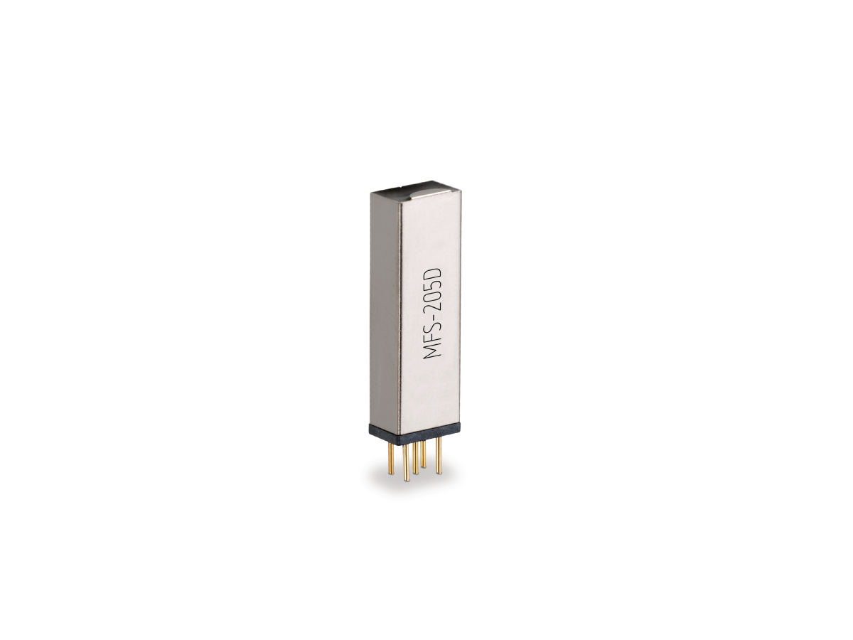 A rectangular, silver-colored Reed Relay from the MFS Series, labeled MFS-205D, featuring four gold pins at the base, isolated on a white background. by Standex Detect