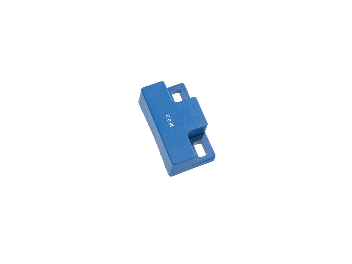 A small blue plastic rectangular M02 Series Magnet with two slots on either side and "M02" printed on its surface, isolated on a white background. by Standex Detect