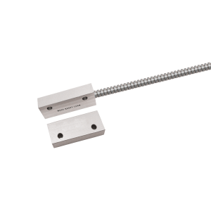 Two rectangular metal blocks with holes, one connected to a flexible, coiled metal conduit or cable—part of the MK27 Series Reed Sensor—are displayed on a white background. by Standex Detect