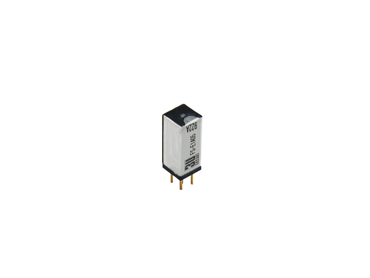 A small rectangular FS Series Reed Relay with two gold pins at the bottom, silver and black casing, and printed text on the side, isolated on a white background. by Standex Detect
